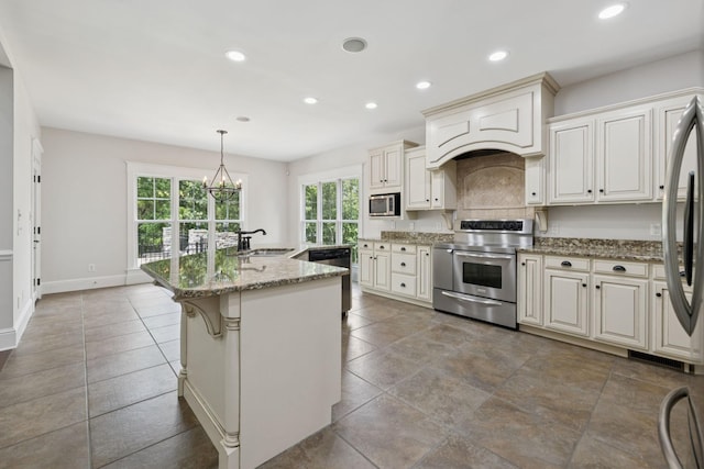 150 Valley Vista Dr, Carthage, TN 37030 - kitchen with appliances with stainless steel finishes, a sink, recessed lighting, light stone countertops, and a center island with sink
