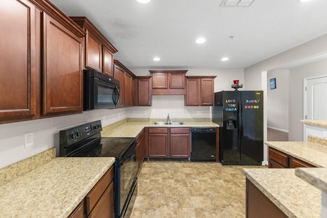 kitchen with black appliances, a sink, light countertops, recessed lighting, and reddish brown cabinets