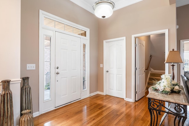 entrance foyer featuring light wood-style floors and baseboards