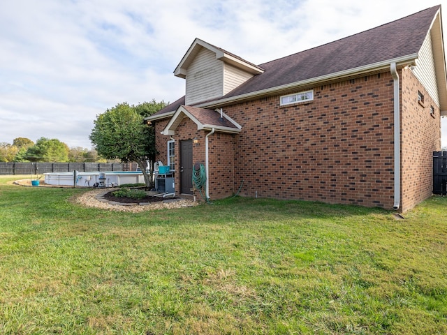 back of property featuring brick siding