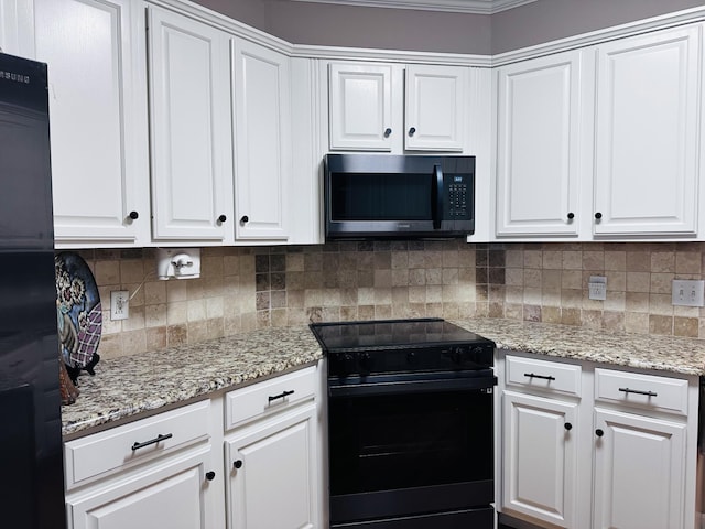 kitchen featuring black range with electric stovetop, white cabinetry, backsplash, and light stone counters