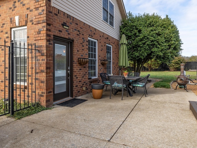 view of patio / terrace featuring outdoor dining space and fence