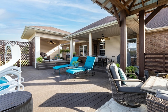 deck with ceiling fan and outdoor dining area