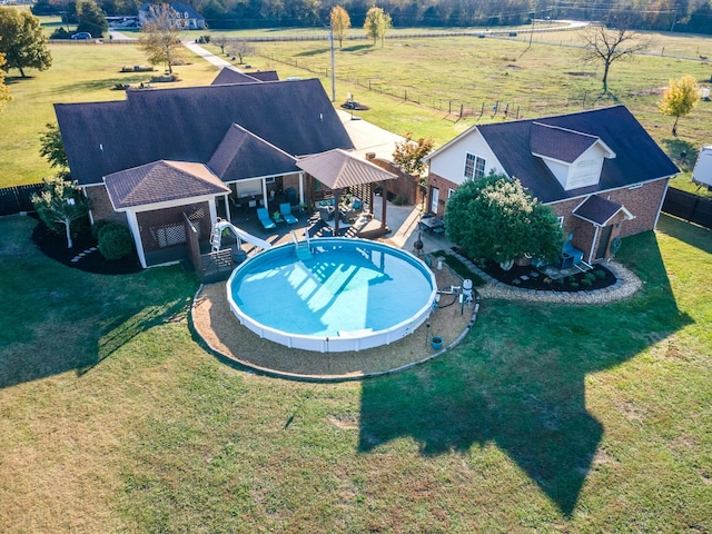 view of swimming pool featuring a gazebo, a water slide, and a patio