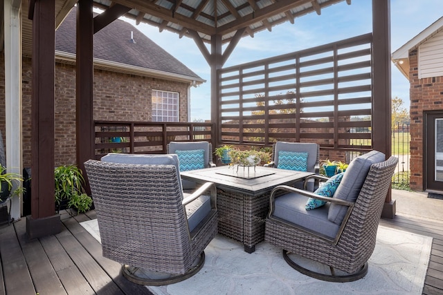 deck featuring outdoor dining space and a gazebo