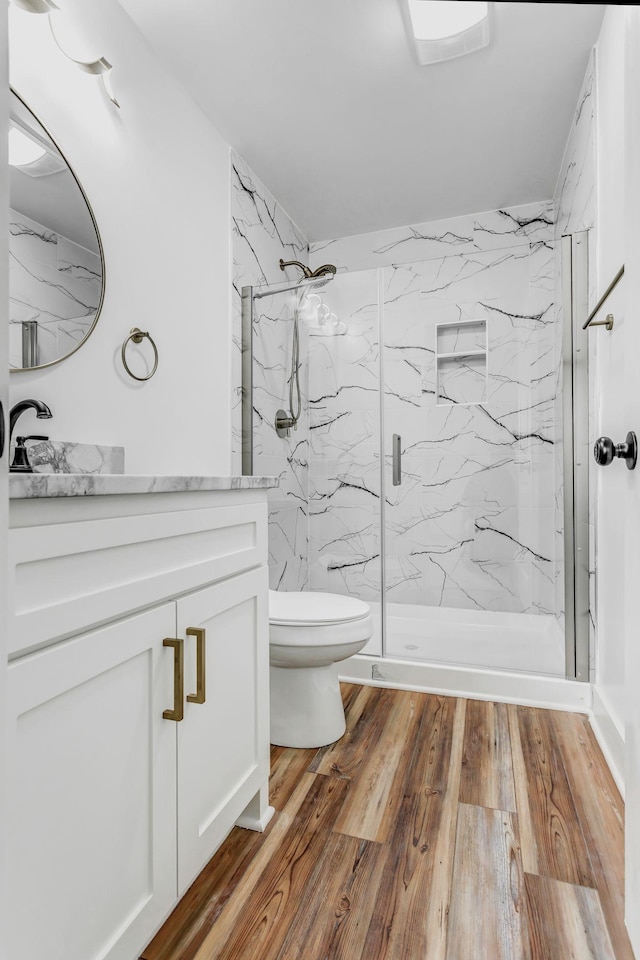 107 Shady St, Summertown, TN 38483 - bathroom with toilet, a marble finish shower, vanity, and wood finished floors