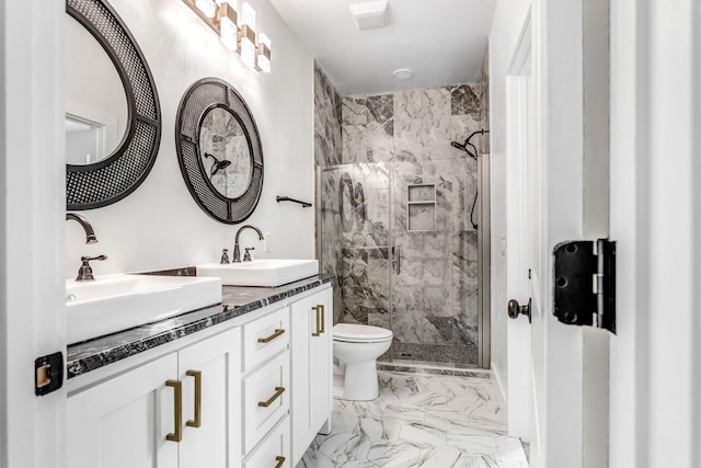107 Shady St, Summertown, TN 38483 - bathroom with marble look tile flooring, tiled shower, double vanity, and toilet