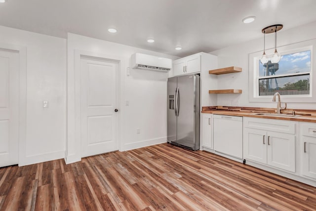 107 Shady St, Summertown, TN 38483 - kitchen with a sink, white dishwasher, stainless steel fridge with ice dispenser, a wall unit AC, and wood counters