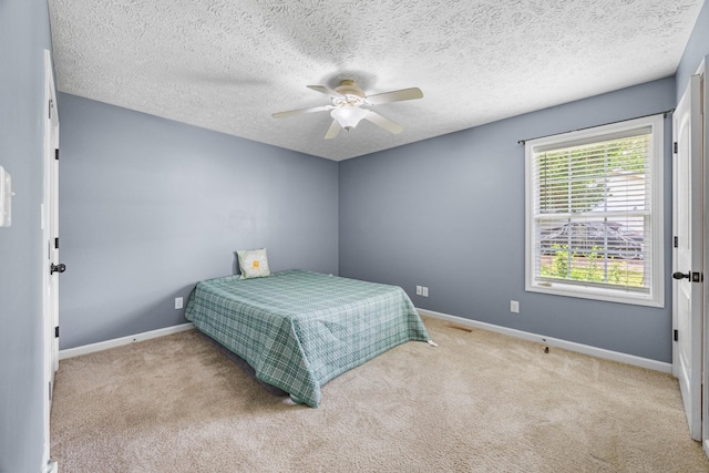 914 Woodland St, Clarksville, TN 37040 - bedroom with carpet, baseboards, a ceiling fan, and a textured ceiling