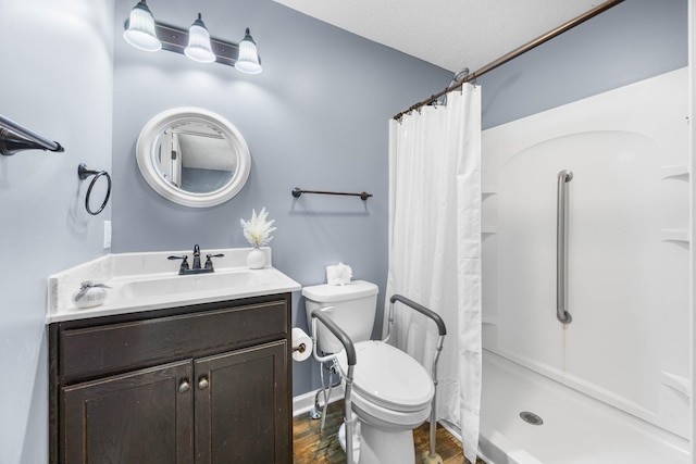 914 Woodland St, Clarksville, TN 37040 - full bath with wood finished floors, curtained shower, toilet, and vanity
