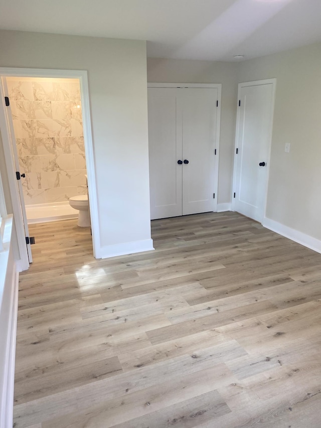 608 Lookout Dr, Columbia, TN 38401 - unfurnished bedroom with light wood-style floors, baseboards, a closet, and connected bathroom
