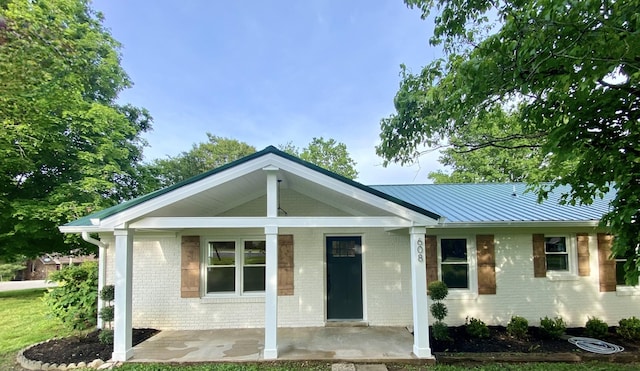 608 Lookout Dr, Columbia, TN 38401 - ranch-style home with brick siding, covered porch, and metal roof