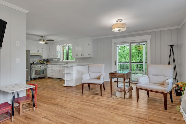 1008 Downey Dr, Nashville, TN 37205 - kitchen with stainless steel appliances, crown molding, healthy amount of natural light, a peninsula, and white cabinets