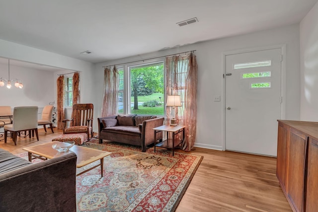 1008 Downey Dr, Nashville, TN 37205 - living room featuring light wood-style floors and a chandelier