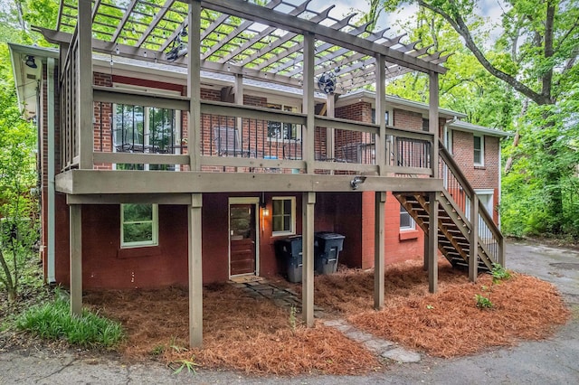 1008 Downey Dr, Nashville, TN 37205 - back of property with a pergola, a deck, brick siding, and stairs