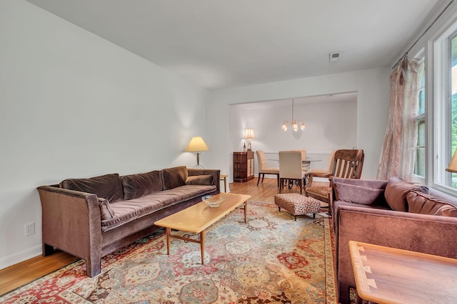 1008 Downey Dr, Nashville, TN 37205 - living area featuring plenty of natural light, wood finished floors, and a chandelier