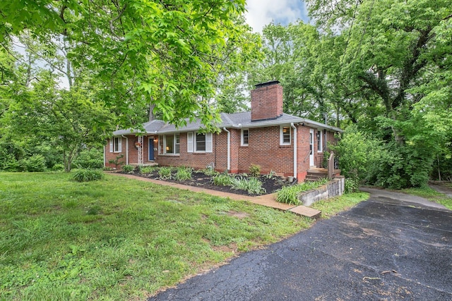 1008 Downey Dr, Nashville, TN 37205 - ranch-style house with brick siding, a chimney, and a front yard