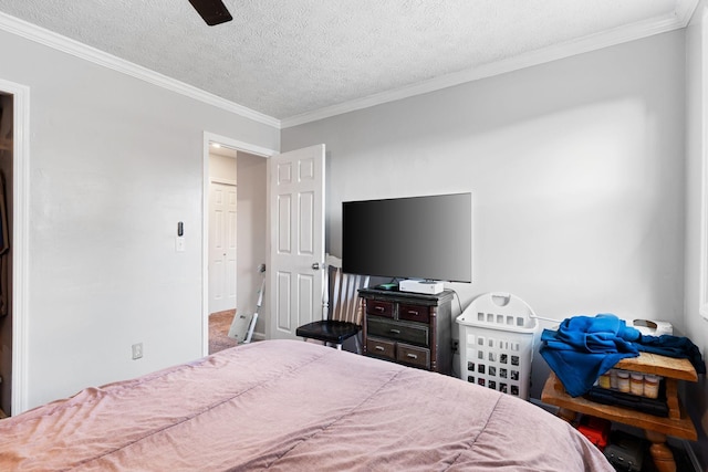 bedroom with ornamental molding, a textured ceiling, and a ceiling fan