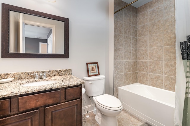 full bath featuring toilet, baseboards, vanity, shower / bath combo, and tile patterned flooring
