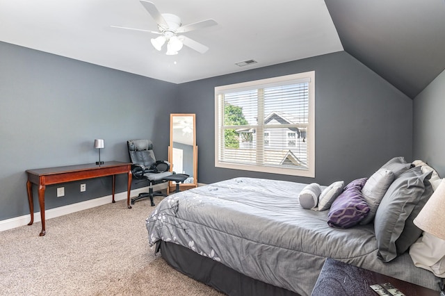 bedroom featuring light carpet, lofted ceiling, baseboards, and a ceiling fan
