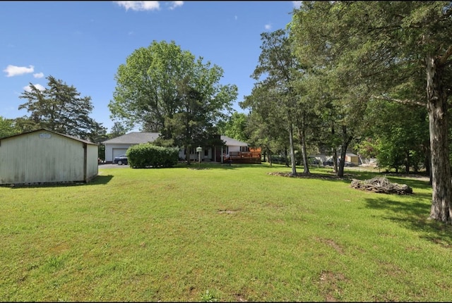 421 Robertson Dr, Smyrna, TN 37167 - view of green lawn with a garage