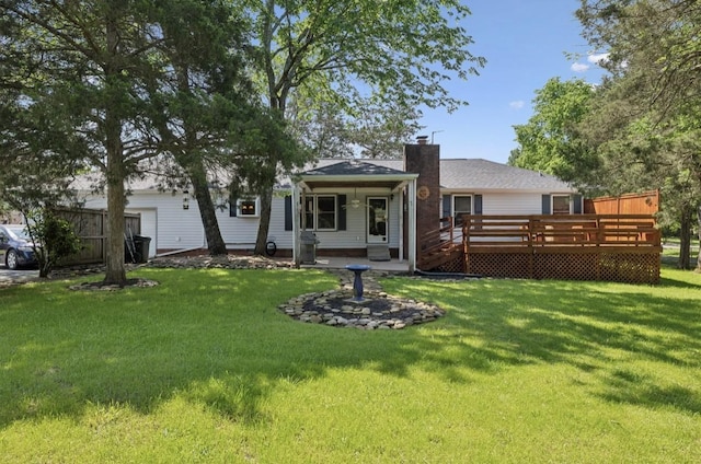 421 Robertson Dr, Smyrna, TN 37167 - rear view of property with a chimney, a yard, and a wooden deck
