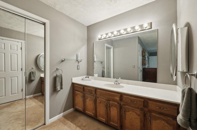 421 Robertson Dr, Smyrna, TN 37167 - bathroom featuring vanity, baseboards, and a textured ceiling