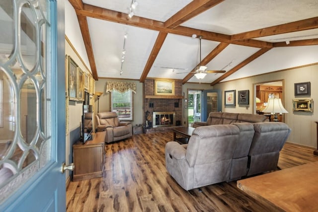 421 Robertson Dr, Smyrna, TN 37167 - living area featuring rail lighting, wood finished floors, a fireplace, and a ceiling fan