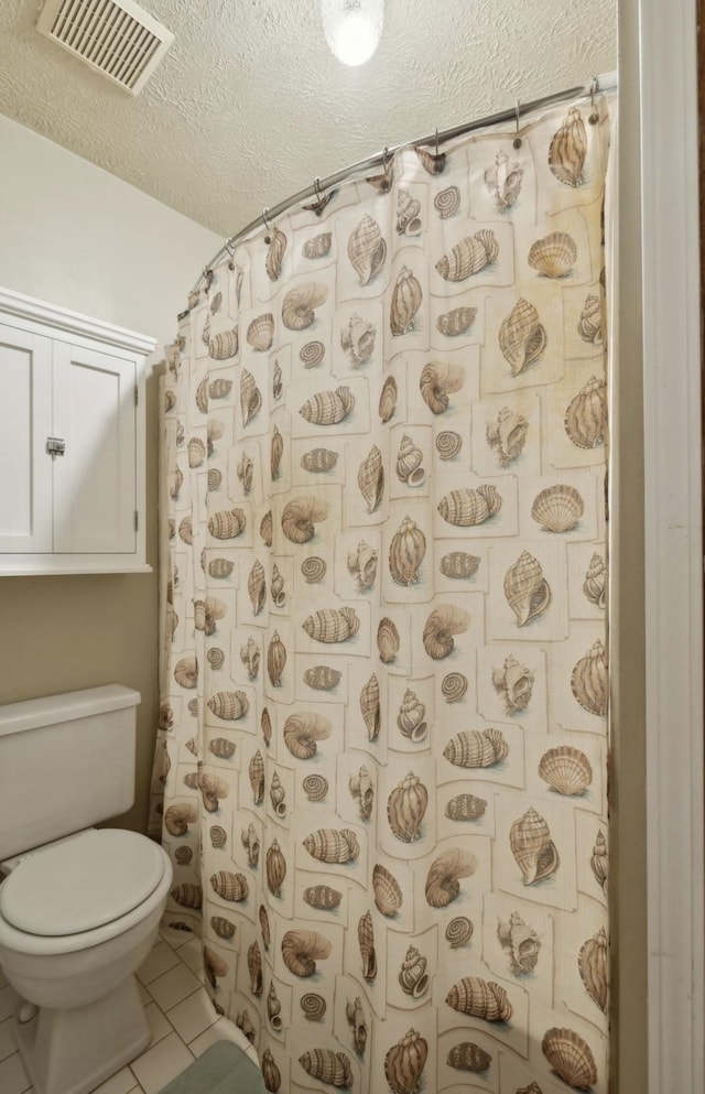 421 Robertson Dr, Smyrna, TN 37167 - bathroom with toilet, a textured ceiling, tile patterned flooring, and curtained shower