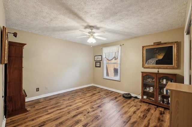 421 Robertson Dr, Smyrna, TN 37167 - empty room with a ceiling fan, wood finished floors, baseboards, and a textured ceiling