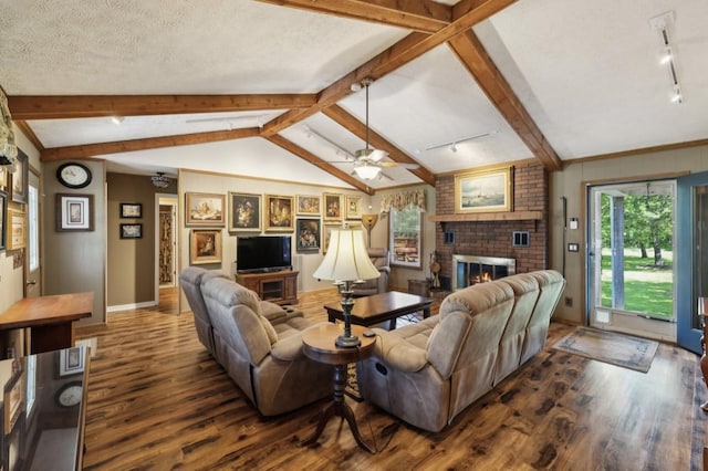 421 Robertson Dr, Smyrna, TN 37167 - living room with wood finished floors, a brick fireplace, ceiling fan, baseboards, and a textured ceiling