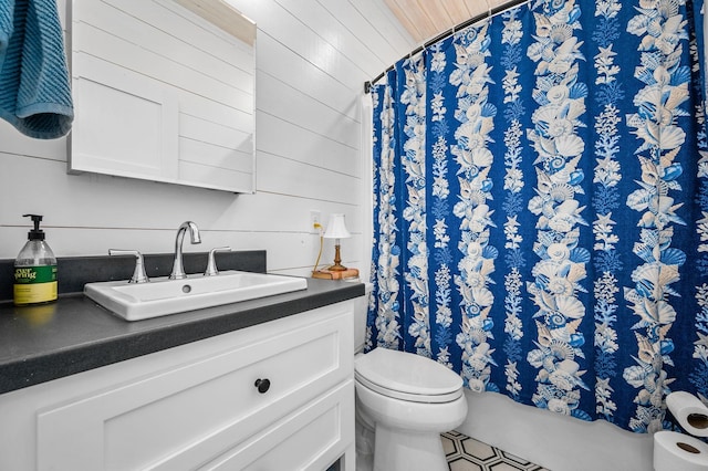 61 Sunset Ct, Tracy City, TN 37387 - full bathroom featuring toilet, vanity, a shower with curtain, and wood walls