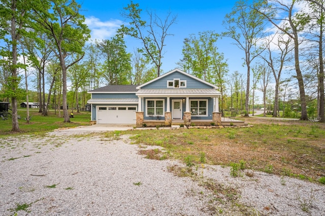 61 Sunset Ct, Tracy City, TN 37387 - view of front of property with a porch, driveway, and an attached garage