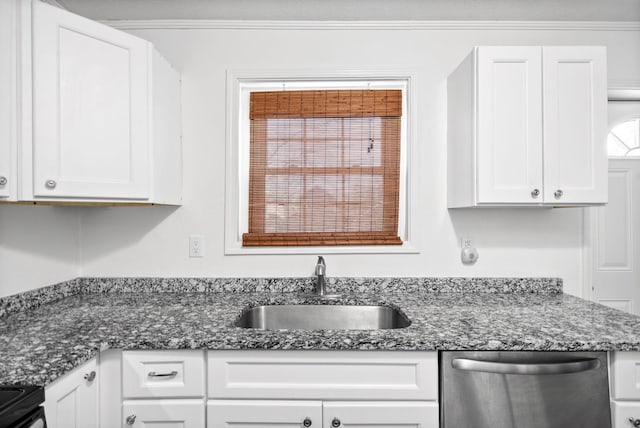 kitchen with stainless steel dishwasher, a sink, white cabinets, black range with electric cooktop, and dark stone countertops
