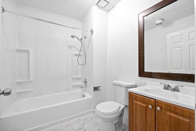 bathroom featuring marble finish flooring, toilet, ornamental molding, vanity, and bathtub / shower combination