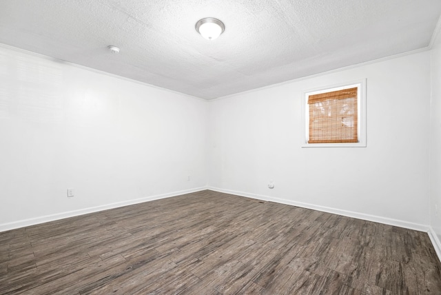 unfurnished room featuring dark wood finished floors, a textured ceiling, baseboards, and a smoke detector