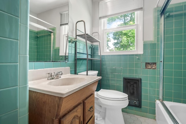 1003 Copper Still Cir, Kingston Springs, TN 37082 - bathroom with tile walls, tile patterned flooring, toilet, heating unit, and vanity