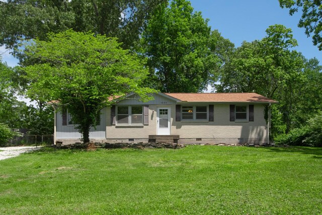 1003 Copper Still Cir, Kingston Springs, TN 37082 - view of front of home featuring crawl space, entry steps, a front lawn, and brick siding