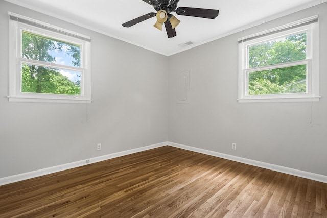 1003 Copper Still Cir, Kingston Springs, TN 37082 - empty room with plenty of natural light, baseboards, wood finished floors, ornamental molding, and ceiling fan