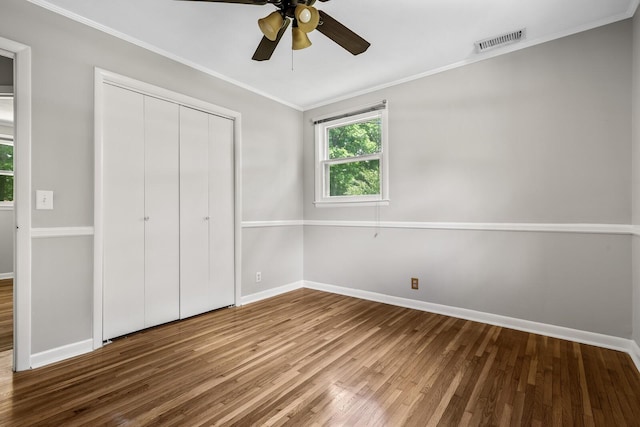 1003 Copper Still Cir, Kingston Springs, TN 37082 - unfurnished bedroom featuring wood finished floors, baseboards, ornamental molding, a closet, and ceiling fan