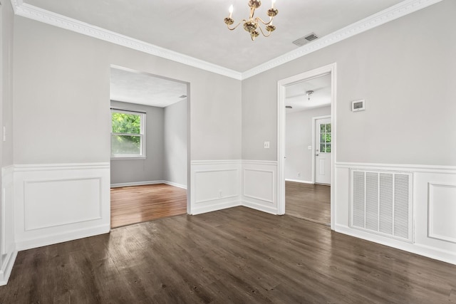 1003 Copper Still Cir, Kingston Springs, TN 37082 - spare room with a chandelier, plenty of natural light, dark wood finished floors, a wainscoted wall, and ornamental molding