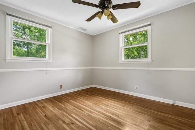 1003 Copper Still Cir, Kingston Springs, TN 37082 - empty room featuring healthy amount of natural light, baseboards, wood finished floors, and ornamental molding