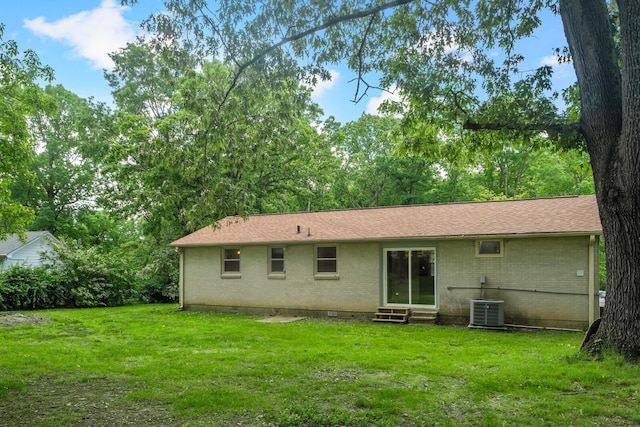 1003 Copper Still Cir, Kingston Springs, TN 37082 - rear view of property with entry steps, brick siding, a yard, and central air condition unit