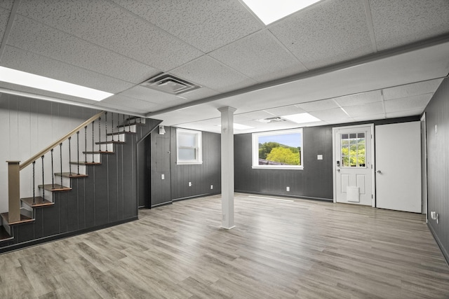 553 Huntington Pkwy, Nashville, TN 37211 - below grade area with wood finished floors, a paneled ceiling, stairway, and wood walls