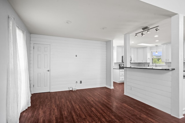 553 Huntington Pkwy, Nashville, TN 37211 - unfurnished living room with dark wood finished floors and track lighting