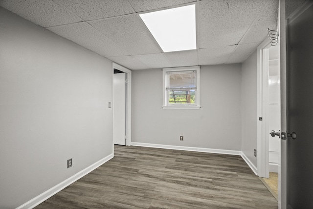 553 Huntington Pkwy, Nashville, TN 37211 - below grade area with a paneled ceiling, baseboards, and wood finished floors