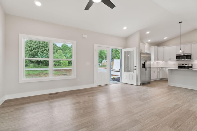 216 Johnson Chapel Rd, Sparta, TN 38583 - unfurnished living room featuring plenty of natural light, light wood-style flooring, lofted ceiling, and recessed lighting