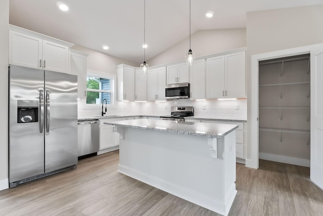 216 Johnson Chapel Rd, Sparta, TN 38583 - kitchen featuring stainless steel appliances, light wood-style flooring, white cabinets, backsplash, and a sink