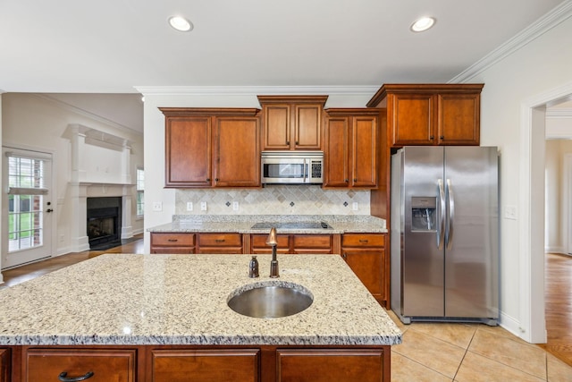 1015 Kingman Ave, Murfreesboro, TN 37129 - kitchen with stainless steel appliances, a sink, ornamental molding, decorative backsplash, and light stone counters