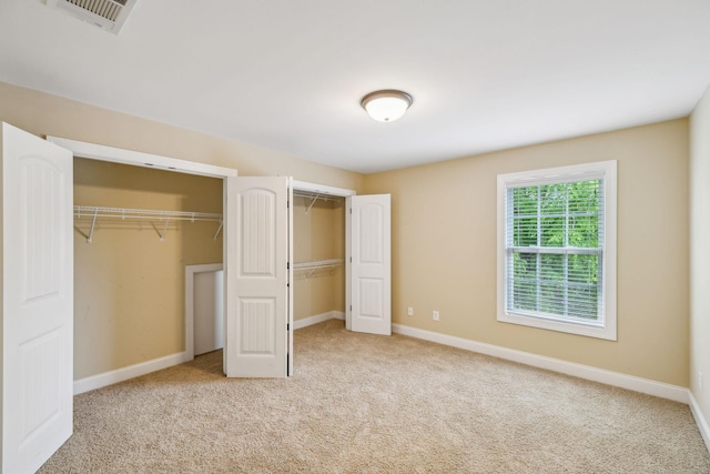 1015 Kingman Ave, Murfreesboro, TN 37129 - unfurnished bedroom with multiple closets, carpet, and baseboards